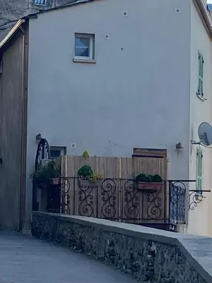 a fence in front of a house with plants on it at A Stella in Borgo