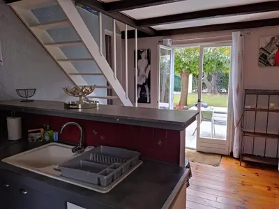 a kitchen with a sink and a counter top at Agréable villa 100 m de la plage in Poggio-Mezzana