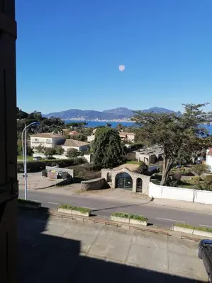a view of a city with a street and a road at Studio face mer Porticcio, proche aéroport Ajaccio in Porticcio