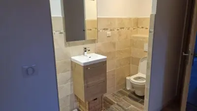 a bathroom with a sink and a toilet at A LIVIA Peri Ajaccio in Peri