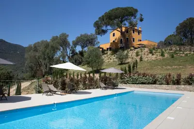 a villa on top of a hill with a swimming pool at Le Domaine Saint François Le Moulin 2 in Ajaccio
