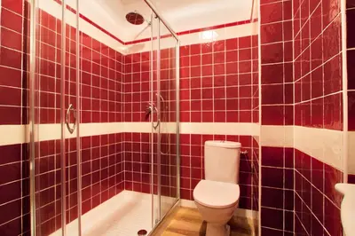 a bathroom with a toilet and a glass shower at Le Domaine Saint François La Tour 1 in Ajaccio