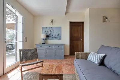a living room with a couch and a table at Le Domaine Saint François La Tour 1 in Ajaccio