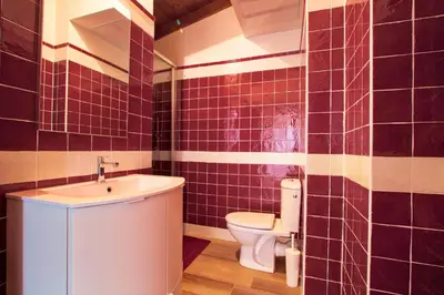 a bathroom with a toilet and a sink at Le Domaine Saint François La Tour 1 in Ajaccio