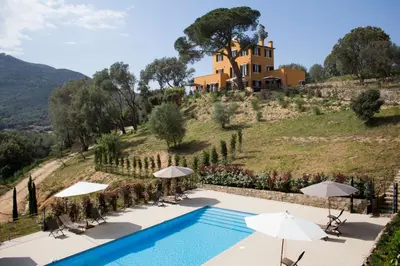 a villa on top of a hill with a swimming pool at Le Domaine Saint François la Tour 2 in Ajaccio