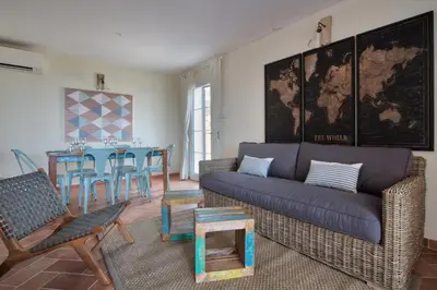 a living room with a couch and a table at Le Domaine Saint François La Tour 3 in Ajaccio