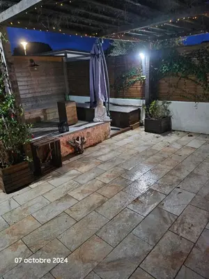 an outdoor patio with a bench and a table at Maison Lido Marana plage in Borgo