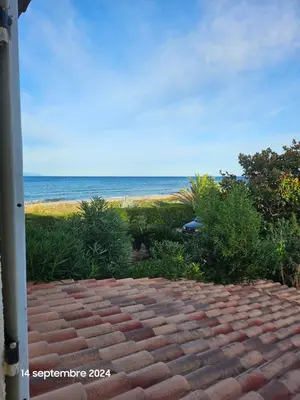 a view of the beach from a house at Maison Lido Marana plage in Borgo