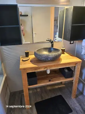 a bathroom with a sink on a wooden table at Maison Lido Marana plage in Borgo
