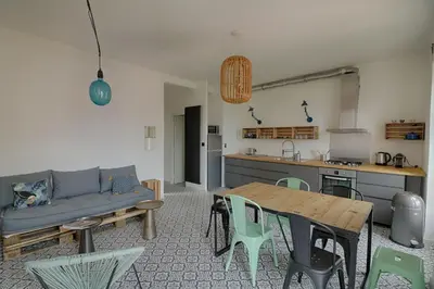 a living room with a couch and a table at Appartement centre ville Citadelle Ajaccio in Ajaccio