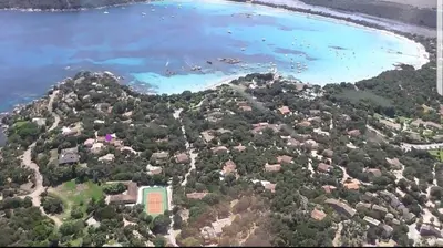 an aerial view of a small island in the water at Villa Occhiatana, Santa Giulia in Porto-Vecchio