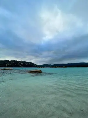 a large body of water with rocks in it at Mini villa Centuri, Santa Giulia in Porto-Vecchio
