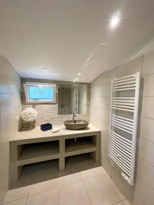 a bathroom with a sink and a mirror at Villa San Antonu, Santa Giulia in Porto-Vecchio