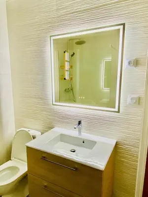 a bathroom with a sink and a toilet and a mirror at Villa Montalbo vue mer avec grande terrasse & plage à proximité - idéale famille et groupe de 2 à 10 personnes in Cargèse