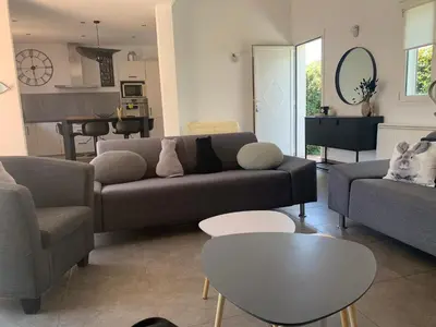a living room with a couch and a table at Villa Fautea Romance in Fautea