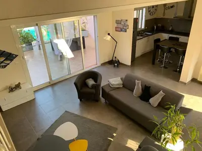 a living room with a couch and a table at Villa Fautea Romance in Fautea