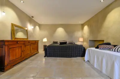 a bedroom with a bed and a dresser and a mirror at casa teppe rosse in Aléria