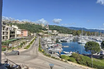 a marina with many boats in the water at Pretty cocoon with harbour view in Porto-Vecchio