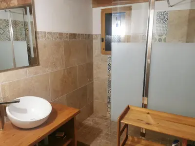 a bathroom with a sink and a shower at Casa Jeromine in Quenza