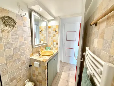 a bathroom with a sink and a mirror at Villa Argentella, Santa Giulia in Porto-Vecchio