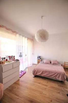 a bedroom with a bed and a dresser at Appartement Le Kent centre ville AJACCIO in Ajaccio