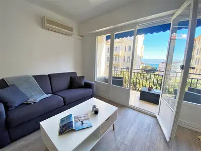 a living room with a couch and a coffee table at Appartement Sacré Coeur 6 couchages AJACCIO in Ajaccio