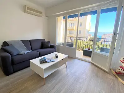a living room with a couch and a coffee table at Appartement Sacré Coeur 6 couchages AJACCIO in Ajaccio