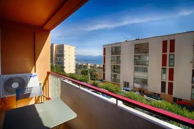 a balcony with a view of a city at Appartement Eugénie centre-ville Ajaccio in Ajaccio
