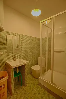 a bathroom with a toilet and a sink and a shower at Studio Conventionnel Chiappe Vieille ville Ajaccio in Ajaccio