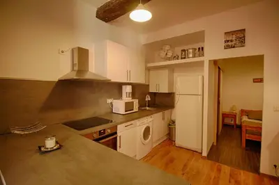 a kitchen with a sink and a microwave at Studio Conventionnel Chiappe Vieille ville Ajaccio in Ajaccio