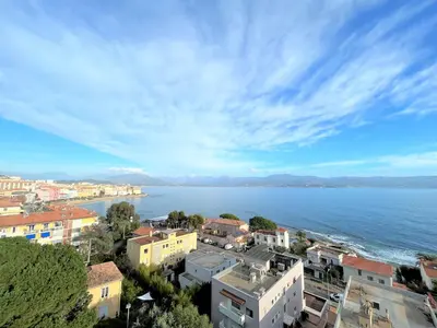 a view of a city and a body of water at Appartement vue mer Carmino Ajaccio in Ajaccio
