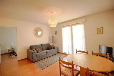 a living room with a couch and a table at Appartement Capo Rosso sanguinaires Ajaccio in Ajaccio