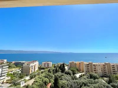 a view of a city and the ocean at Appartement le Sicile sanguinaires Ajaccio in Ajaccio