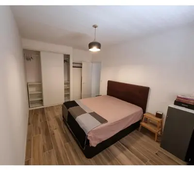 a bedroom with a bed in a room at Appartement proche plage in Ajaccio