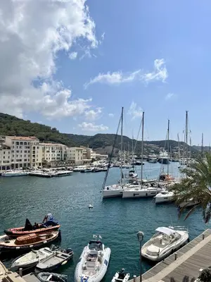 a group of boats docked in a harbor with buildings at Joli T3 sur le port de Bonifacio avec vue mer in Bonifacio