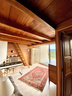 a living room with a couch and a table at Appartement Haut de Villa centre-ville CORTE in Corte