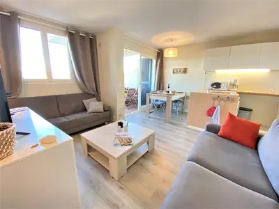 a living room with a couch and a table at Appartement 86 Terra Bella 1 Porticcio in Porticcio