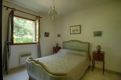 a bedroom with a bed and a window at VILLA 200 m de la plage La Liscia TIUCCIA in Casaglione