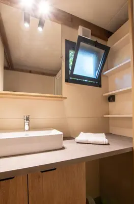 a bathroom with a sink and a window at BAVELLA VISTA in Zonza