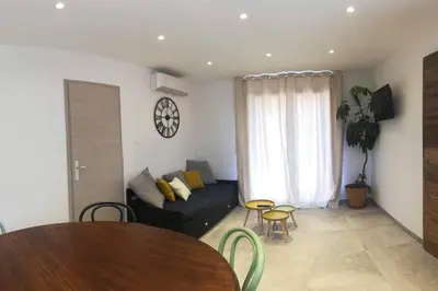 a living room with a couch and a table at Location Casa Di Lesia à Sotta / Porto-Vecchio in Sotta