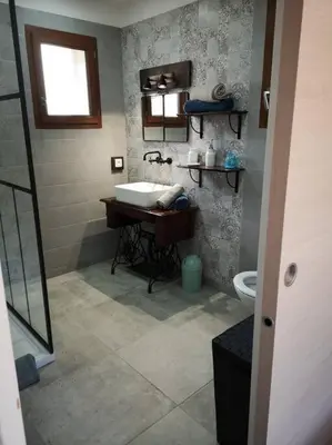 a bathroom with a sink and a toilet at Location Casa Di Lesia à Sotta / Porto-Vecchio in Sotta