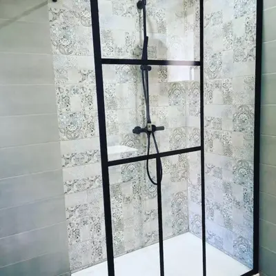 a shower with a glass door in a bathroom at Location Casa Di Lesia à Sotta / Porto-Vecchio in Sotta