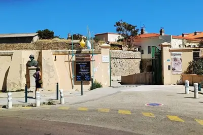 a person is standing in front of a building at Appartement T2 Ajaccio vieille ville in Ajaccio