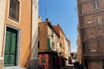 an alley with buildings on a city street at Appartement T2 Ajaccio vieille ville in Ajaccio
