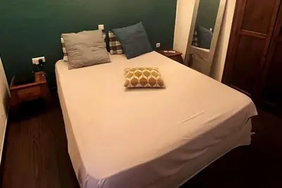 a large white bed in a room at Appartement T2 Ajaccio vieille ville in Ajaccio