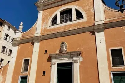 a building with a clock tower with a statue on it at Appartement T2 Ajaccio vieille ville in Ajaccio