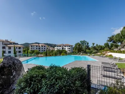 a view of a swimming pool in a resort at Apartment Domaine d'Arca G6 by Interhome in Porto-Vecchio