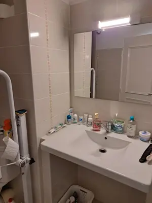 a bathroom with a white sink and a mirror at Casa D'Amore T3 in Ajaccio