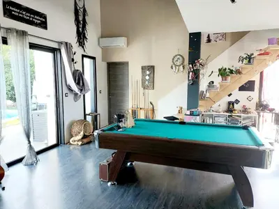 a living room with a pool table in it at Chez Cendra in Borgo