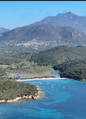 an aerial view of a river with mountains in the background at Villa proche plage extrême sud Corse in Monacia-dʼAullène